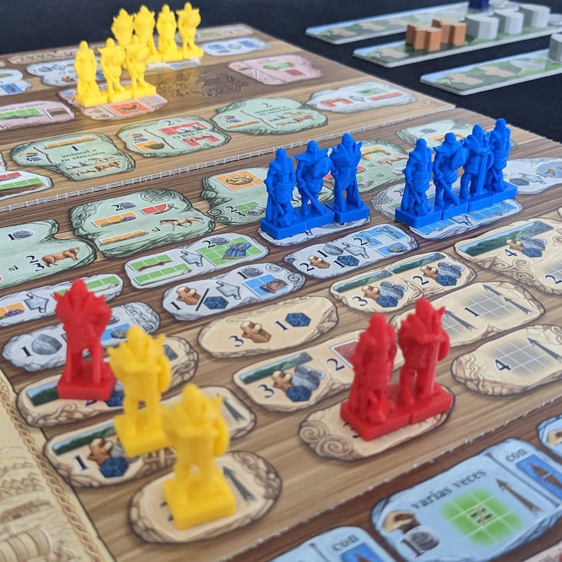 May include: A game board with blue, red, and yellow miniature figures. The figures are arranged in rows on the board, which has a wooden surface and a variety of printed symbols and numbers.