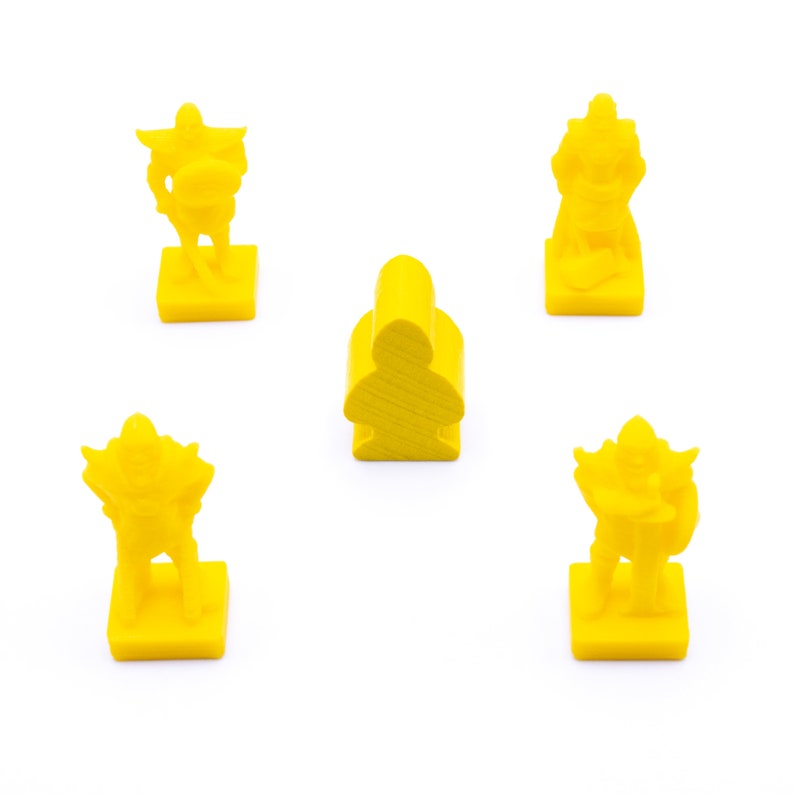 May include: Four yellow plastic game pieces, three are figures with swords and shields, and one is a simple standing figure. The pieces are on a white background.