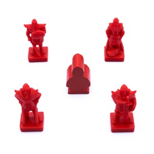 May include: Four red plastic game pieces, three are warriors with swords and shields, and one is a simple pawn. The pieces are on a white background.