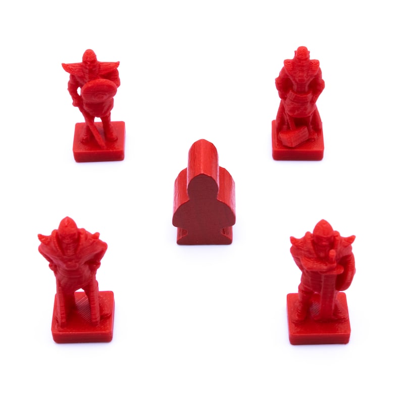 May include: Four red plastic game pieces, three are warriors with swords and shields, and one is a simple pawn. The pieces are on a white background.