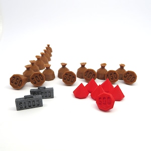 May include: A set of brown money bags with different dollar amounts, including $250, $300, $350, $400, $450, and $500. There are also five red diamond-shaped tokens with the number 600 on one of them. There are three gray suitcases with the numbers $1000 and $500 on them.