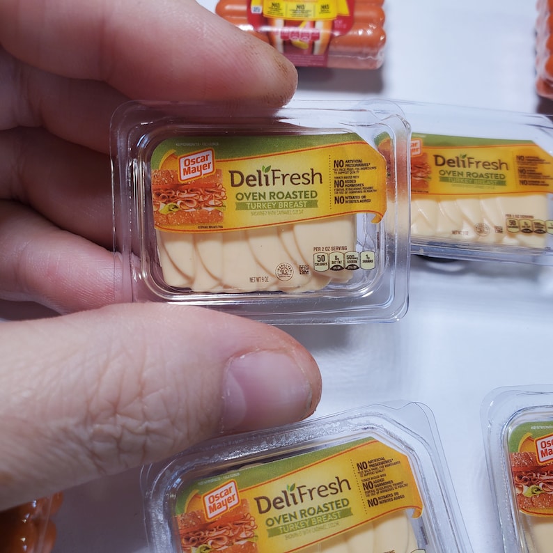 May include: Three packages of Oscar Mayer DeliFresh Oven Roasted Turkey Breast. Each package contains sliced turkey breast and has a yellow label with the brand name and product description.