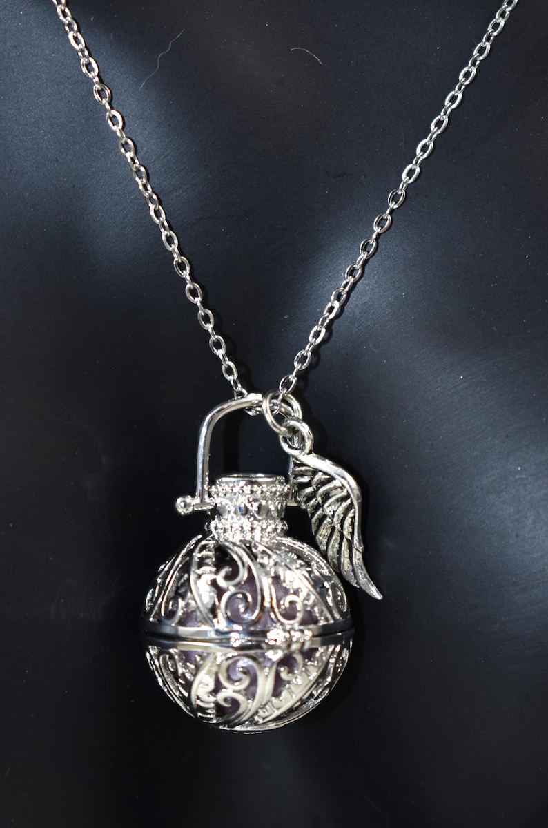 Silver Angel caller bola harmony chime ball necklace. Cut-out leaf pendant, chime ball Legend says this soft chiming sound calls your guardian angel Angel caller locket, 316 stainless steel chain. Popular with expectant Mothers. Jewelry gift for her. birthday gift, Christmas gift for her, harmony chime ball locket necklace, metallic pink harmony chime ball, gift for wife, gift for Mom, gift for daughter, gift for sister, silver angel caller necklace gift for her