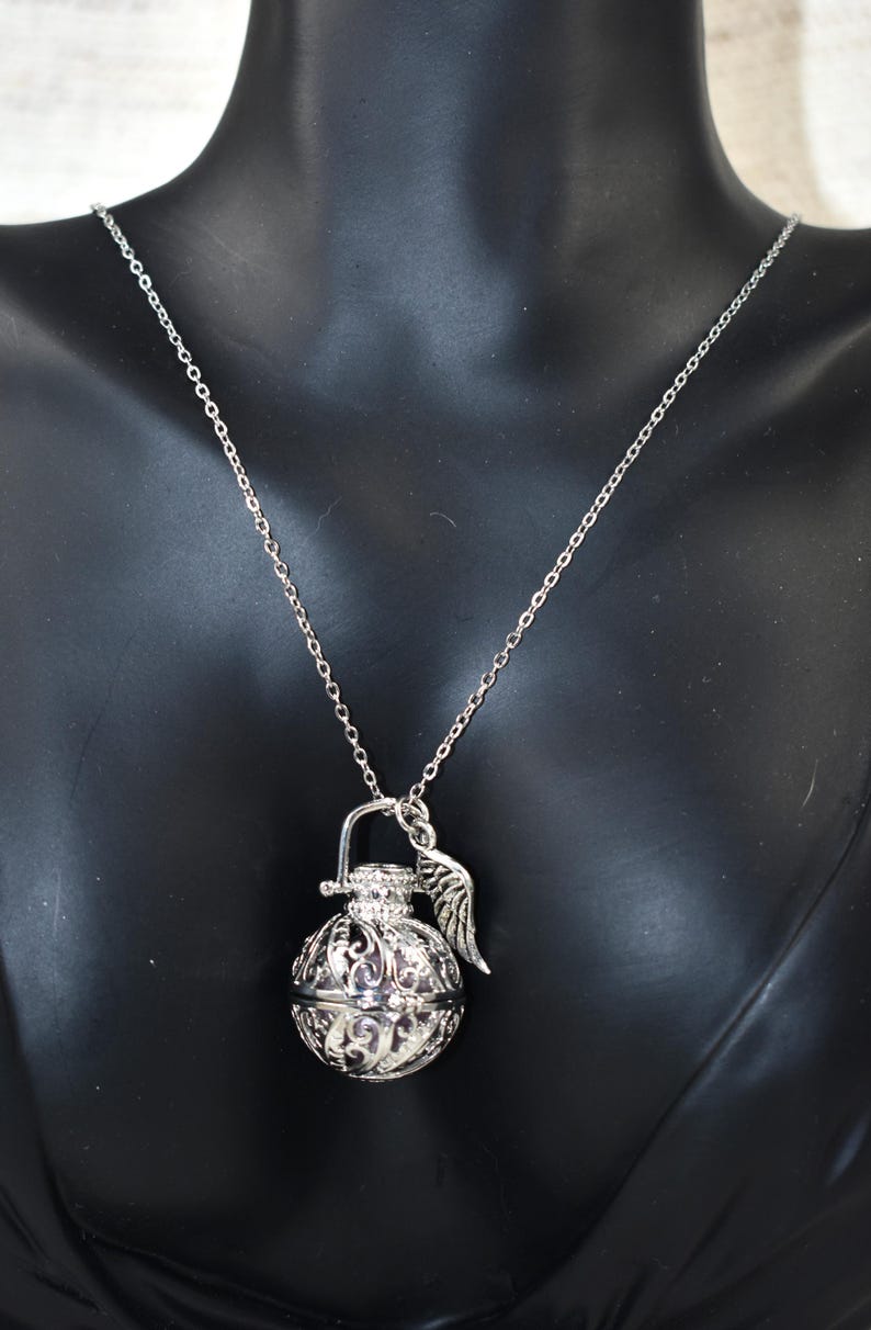 Silver Angel caller bola harmony chime ball necklace. Cut-out leaf sphere pendant, chime ball locket necklace, soft chiming sound calls your guardian angel, Angel caller locket, 316 stainless steel chain. Popular with expectant Mothers. Jewelry gift for her. Gift for Mom, gift for wife, gift for sister, gift for daughter, birthday gift, pregnancy jewelry