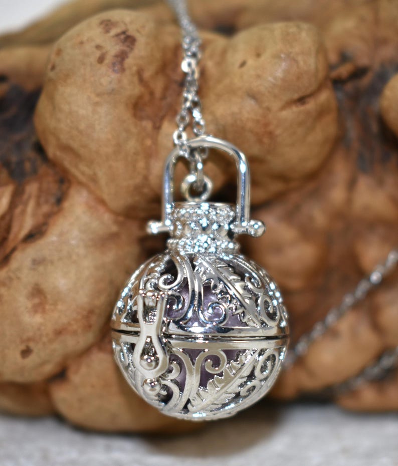 Silver Angel caller bola harmony chime ball necklace. Cut-out leaf sphere pendant, chime ball locket necklace, soft chiming sound calls your guardian angel, Angel caller locket, 316 stainless steel chain. Popular with expectant Mothers. Jewelry gift for her. Gift for Mom, gift for wife, gift for sister, gift for daughter, birthday gift, pregnancy jewelry