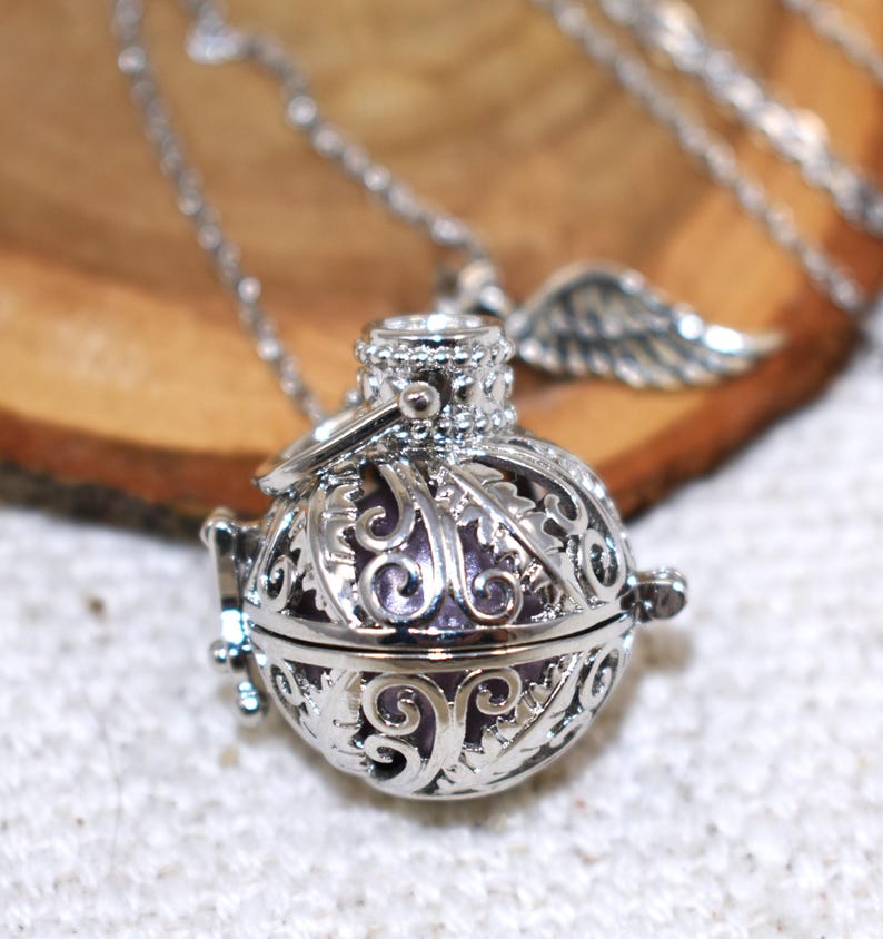 Silver Angel caller bola harmony chime ball necklace. Cut-out leaf sphere pendant, chime ball locket necklace, soft chiming sound calls your guardian angel, Angel caller locket, 316 stainless steel chain. Popular with expectant Mothers. Jewelry gift for her. Gift for Mom, gift for wife, gift for sister, gift for daughter, birthday gift, pregnancy jewelry