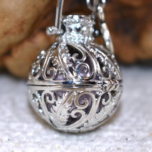 Silver Angel caller bola harmony chime ball necklace. Cut-out leaf pendant, chime ball Legend says this soft chiming sound calls your guardian angel Angel caller locket, 316 stainless steel chain. Popular with expectant Mothers. Jewelry gift for her. birthday gift, Christmas gift for her, harmony chime ball locket necklace, metallic pink harmony chime ball, gift for wife, gift for Mom, gift for daughter, gift for sister, silver angel caller necklace gift for her