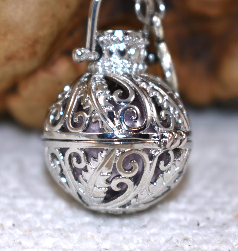 Silver Angel caller bola harmony chime ball necklace. Cut-out leaf pendant, chime ball Legend says this soft chiming sound calls your guardian angel Angel caller locket, 316 stainless steel chain. Popular with expectant Mothers. Jewelry gift for her. birthday gift, Christmas gift for her, harmony chime ball locket necklace, metallic pink harmony chime ball, gift for wife, gift for Mom, gift for daughter, gift for sister, silver angel caller necklace gift for her