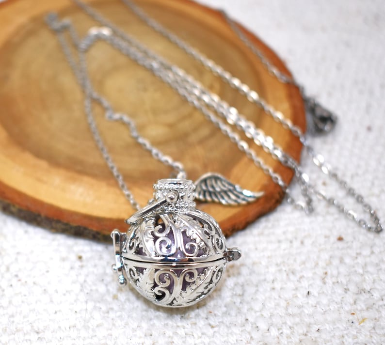 Silver Angel caller bola harmony chime ball necklace. Cut-out leaf sphere pendant, chime ball locket necklace, soft chiming sound calls your guardian angel, Angel caller locket, 316 stainless steel chain. Popular with expectant Mothers. Jewelry gift for her. Gift for Mom, gift for wife, gift for sister, gift for daughter, birthday gift, pregnancy jewelry