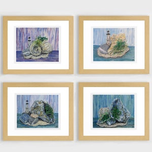 May include: Four framed paintings of seashells, rocks, and a lighthouse on a blue and white background. Each painting is in a light wood frame.