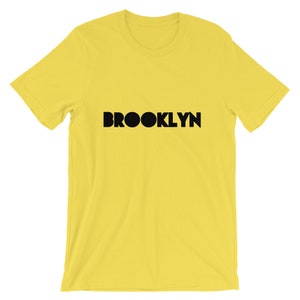 Brooklyn in verschillende felle kleuren - korte-mouw Unisex T-Shirt