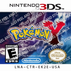 May include: A Nintendo 3DS video game cover for Pokémon Y featuring a blue and purple textured background, the yellow and blue Pokémon logo, a red Y emblem, an ESRB Everyone rating, the Nintendo logo, and the product code LNA-CTR-EK2E-USA.