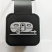 A black and white 3d printed image of a camper on a rubber tail hitch cover