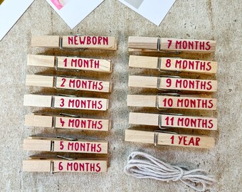 12 Month Baby Photo Holder for First Year Pictures, Newborn Boy or Girl Clothespin Display with 13 Custom Wood Clips, Birthday Month Banner