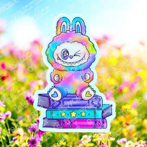 Monster Doll Sitting on Books | Bookish Sticker | Kindle Laptop Decal | Cute Sticker | Bookish Gift | Kindle Sticker