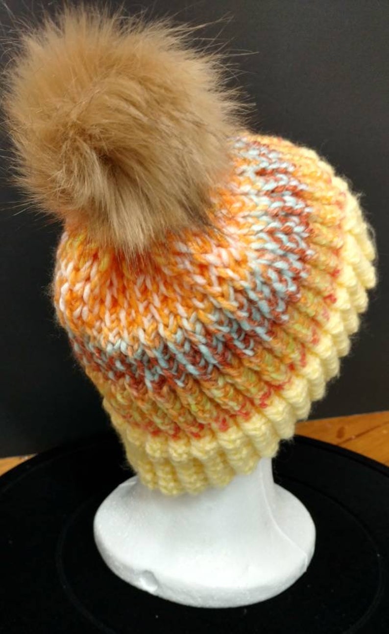 can be worn by adults or young adults Lightweight winter cap with built in brim and removabledetachable pom Great gift 20 circumference
