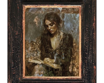 May include: A framed painting depicts a woman reading a book. The artwork features a dark color palette with a black frame and a gold inner border. The woman is dressed in dark clothing, and the painting has a vintage, classical style.