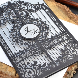 Black laser cut invitation with silver insert, gatefold invitation