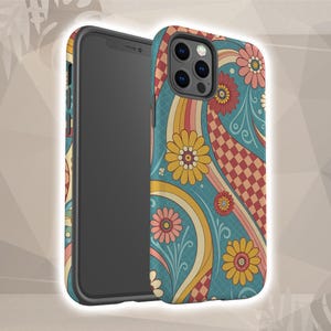 May include: A phone case with a retro floral design. The case features a teal background with yellow, pink, and red flowers, along with wavy lines and a checkered pattern. The phone case is black.