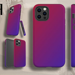 May include: A phone case with a gradient design that transitions from pink to purple. The case has a raised camera bump and a cutout for the phone's buttons.