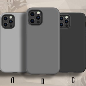 May include: Three phone cases in different colors: gray, dark gray, and black. The cases are all made of a soft, flexible material and have a smooth finish. The cases have a raised camera bump to protect the phone's camera lenses.