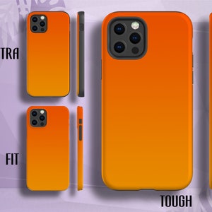 May include: Two orange phone cases with a gradient effect. The case on the left says "FIT" and the case on the right says "TOUGH".