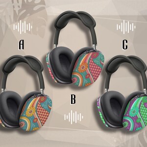 May include: Three pairs of over-ear headphones with black earcups and headbands. The earcups feature colorful floral and geometric patterns in teal, orange, pink, and green. The letters A, B, and C are visible.