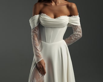 Vestido de novia de satén con hombros descubiertos: corpiño de encaje tipo corsé, falda con abertura y corte moderno.