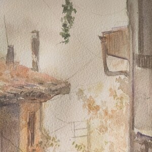 May include: Watercolor painting of a European street scene. The artwork depicts buildings with terracotta roofs, a window, and hanging greenery. The color palette includes warm tones of brown, beige, and green, creating a vintage aesthetic.