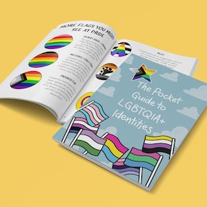May include: A blue booklet with a white star and the text "The Pocket Guide to LGBTQIA+ Identities". The cover features illustrations of various pride flags, including the transgender, bisexual, and pansexual flags.