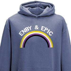 May include: A blue hooded sweatshirt with a rainbow and the text "ENBY & EPIC" in white.