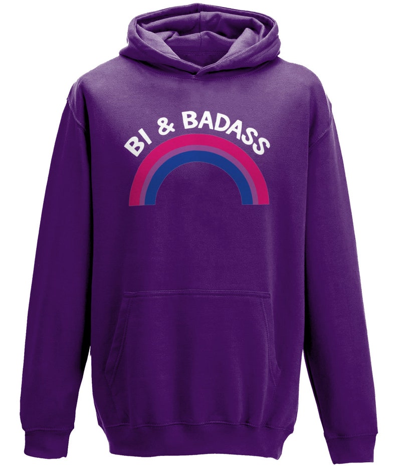 May include: Purple hooded sweatshirt with a rainbow and the text "Bi & Badass" in white.