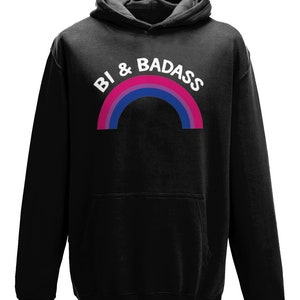 May include: Black hooded sweatshirt with a rainbow graphic and the text "Bi & Badass" in white.