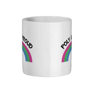 May include: White ceramic mug with a rainbow design and the text "POLY & PROUD" on it.