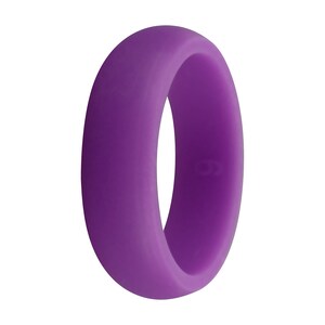 May include: A solid purple silicone ring. The ring is a vibrant shade of purple and has a smooth, matte finish. The ring is a size 9. This ring is a comfortable and durable alternative to traditional metal rings.
