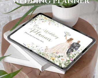 May include: A digital tablet displaying a wedding planner cover with the text "The Ultimate Wedding Planner" and "Our Wedding Planner". The graphic features a bride and groom illustration surrounded by colorful wildflowers and greenery.