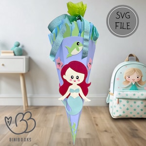 May include: A blue and purple mermaid-themed school cone with a mermaid, a fish, and seaweed decorations. The cone is decorated with a green bow and blue ribbon. The text "SVG FILE" is in a gray circle on a white background.