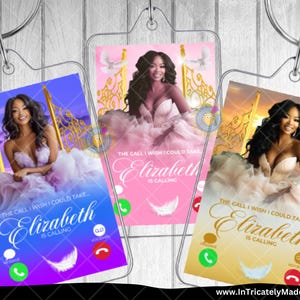 May include: Three clear acrylic keychains featuring a woman in a formal gown. Each keychain has a different background color: blue, pink, and gold. The text "Elizabeth is Calling" is displayed on each keychain, along with a feather graphic and phone icons.