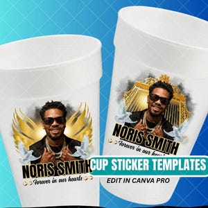 May include: Two white cup templates with a memorial design. Each cup features a photo of a man wearing sunglasses, with the name "NORIS SMITH" and the phrase "Forever in our hearts." Gold wings and doves are also included.
