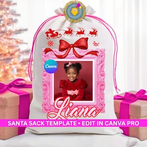 May include: A white drawstring Santa sack featuring a red silhouette of Santa in a sleigh with reindeer, a large red bow, and a pink ornate frame containing a photo of a child. The name Liana is printed below the frame. Text reads SANTA SACK TEMPLATE.