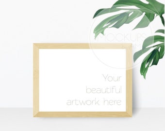 Download Free Cozy styled mockup with leaves and horizontal frame PSD Template