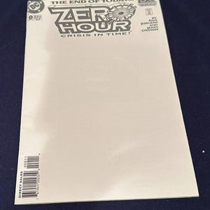 May include: A Zero Hour: Crisis in Time! comic book issue 0 with a white cover. The title is printed in black at the top with the DC logo, issue number, and credits for Dan Jurgens and Jerry Ordway. A barcode is visible in the bottom left corner.