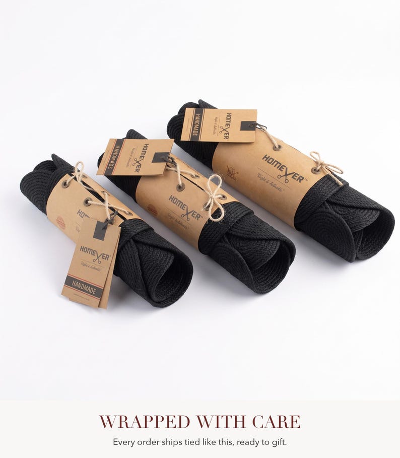 Black cotton rope item rolled and wrapped in kraft paper with cream twine and a kraft gift tag, with text reading Wrapped With Care, every order ships tied like this, ready to gift.