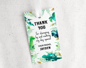 May include: Thank you for stomping by and making my day special. Your friend, Jayden. Green and blue dinosaur thank you tag with a white background and green leaves.