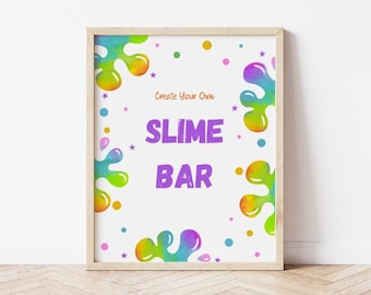 May include: A framed poster with a white background and the words "SLIME BAR" in large purple letters. The poster has colorful paint splatters and small stars and dots. The text "Create Your Own" is above the words "SLIME BAR".