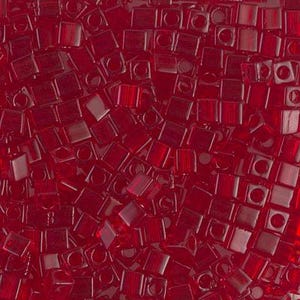 May include: A close-up image of a large quantity of small, red, square-shaped glass beads. The beads have a hole in the center and are translucent.