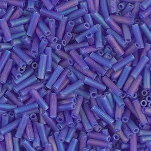 May include: A large quantity of iridescent blue glass beads in a tube shape. The beads have a slight purple hue.