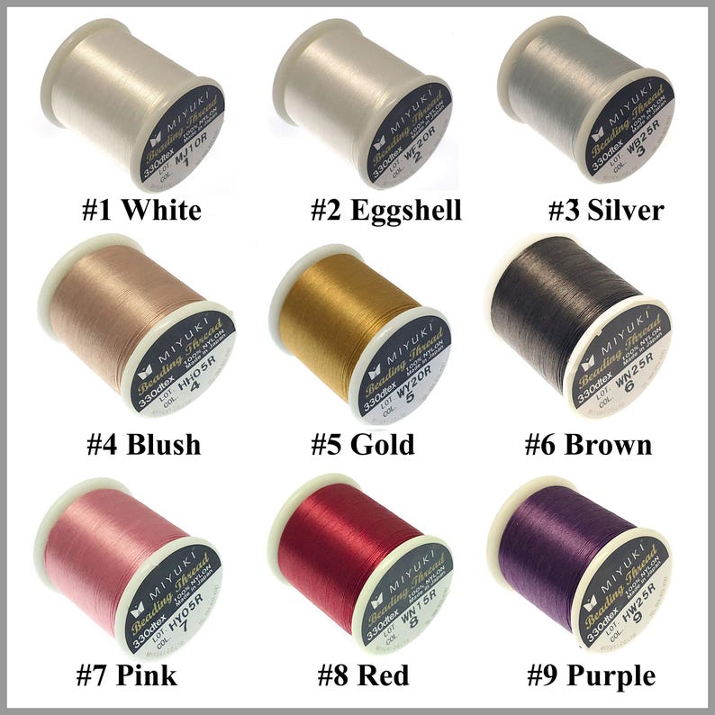 May include: Nine spools of Miyuki beading thread in various colors including white, eggshell, silver, blush, gold, brown, pink, red, and purple. Each spool is labeled with its color name, number, and technical specifications like 330dtex.