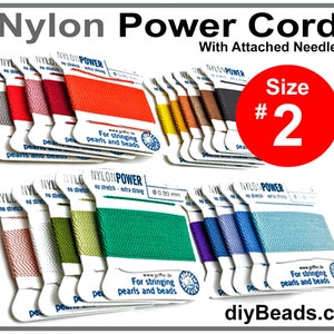 May include: Assortment of nylon power cord spools in various colors, labeled "Nylon Power" and "For stringing pearls and beads". The cord is size #2 and comes with an attached needle. diyBeads.com is printed on the bottom right corner.