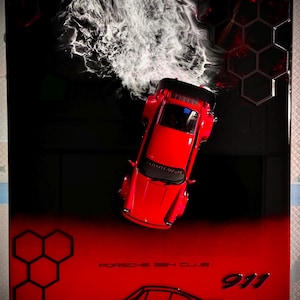May include: A red Porsche 911 toy car is featured on a red and black background. The artwork includes the text "Porsche 964 Club" and a car outline. White smoke-like shapes are in the background.